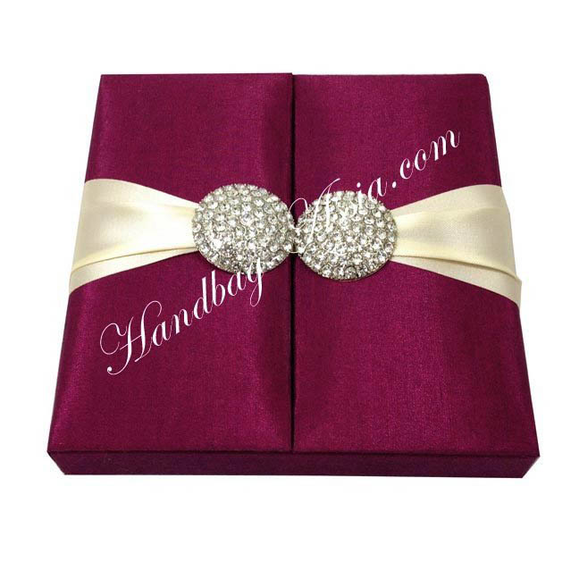 silk invitation with magenta faux silk brooch embellishment